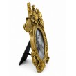 Vue de profil du cadre photo ovale doré de 28 cm, décor floral en relief et pied arrière déployé - 3